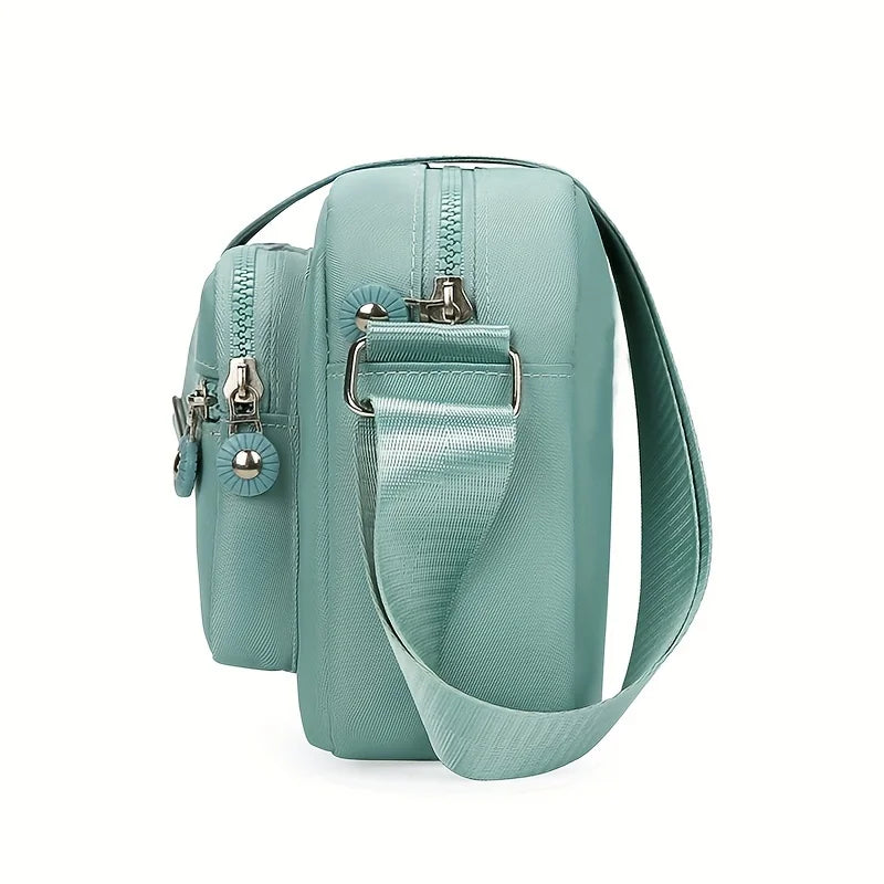 Lightweight Nylon Chic Crossbody Bag for Women - Adjustable Strap, Zip Closure, Tassel Accent, Solid Color