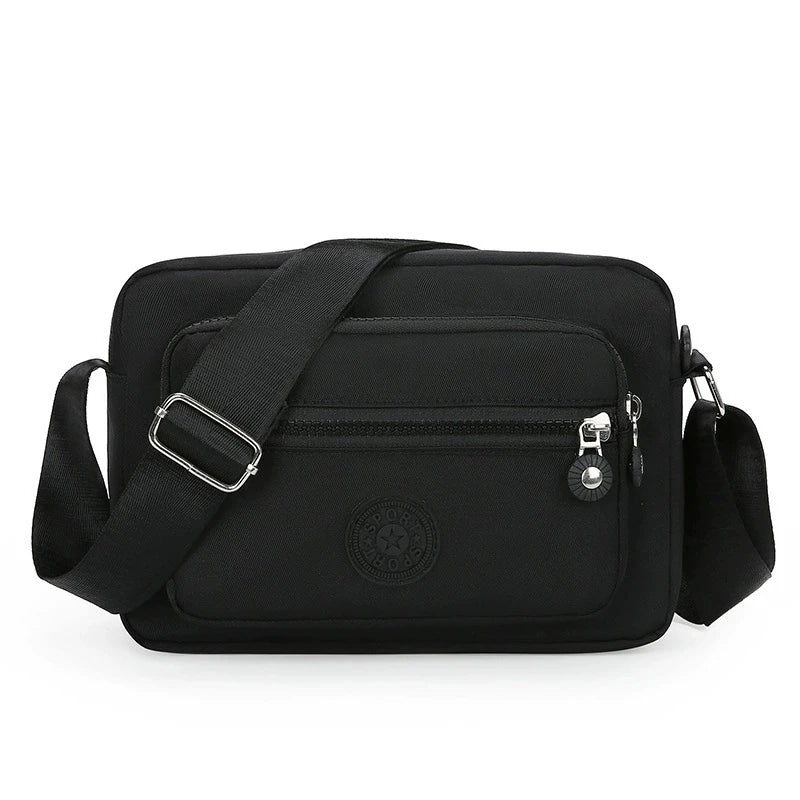 Lightweight Nylon Chic Crossbody Bag for Women - Adjustable Strap, Zip Closure, Tassel Accent, Solid Color