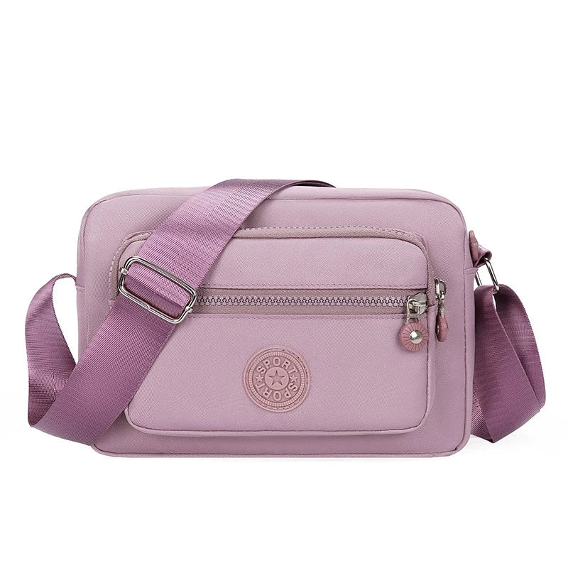 Lightweight Nylon Chic Crossbody Bag for Women - Adjustable Strap, Zip Closure, Tassel Accent, Solid Color