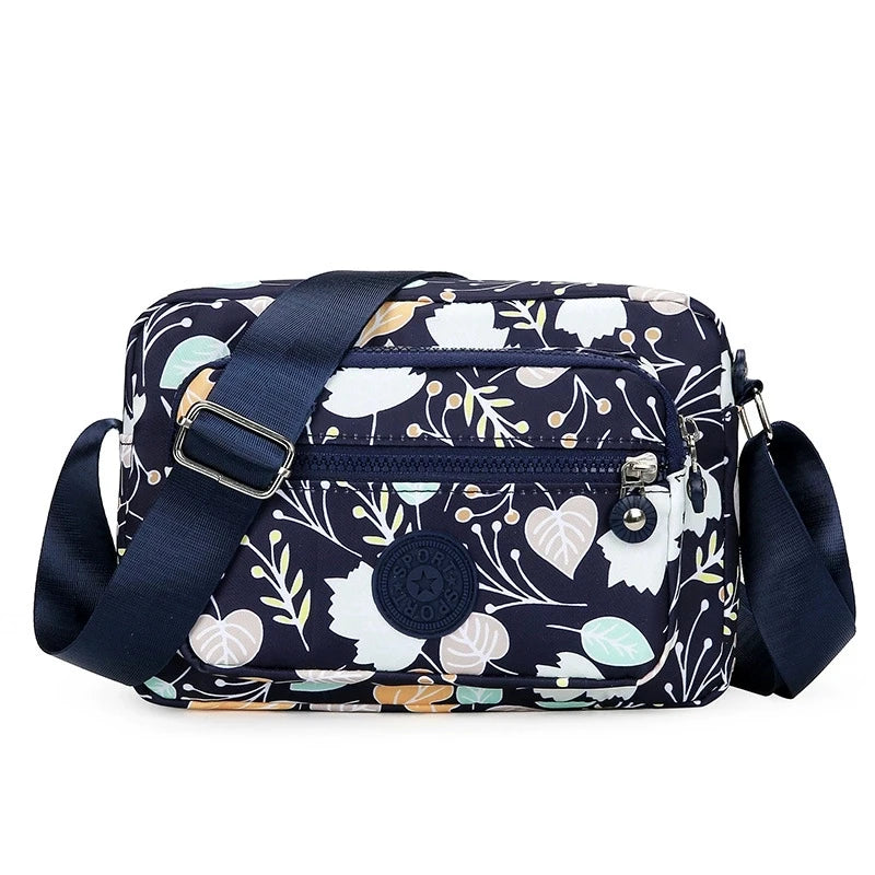 Lightweight Nylon Chic Crossbody Bag for Women - Adjustable Strap, Zip Closure, Tassel Accent, Solid Color