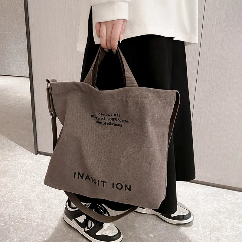 Large capacity backpack Men's and women's shoulder bag canvas crossbody bag Men's handbag College class bag Men's commuter bag