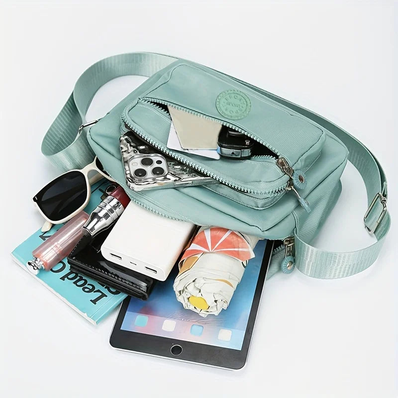 Lightweight Nylon Chic Crossbody Bag for Women - Adjustable Strap, Zip Closure, Tassel Accent, Solid Color