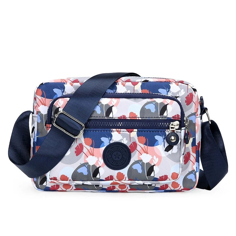 Lightweight Nylon Chic Crossbody Bag for Women - Adjustable Strap, Zip Closure, Tassel Accent, Solid Color