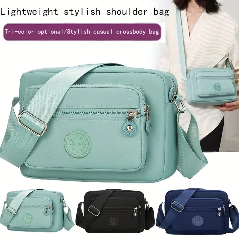 Lightweight Nylon Chic Crossbody Bag for Women - Adjustable Strap, Zip Closure, Tassel Accent, Solid Color